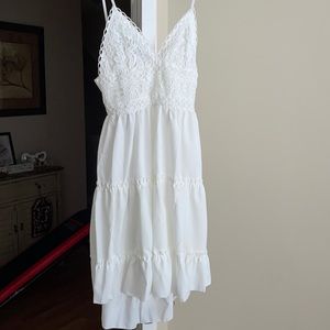 Brand new!! White ruffled, open back dress